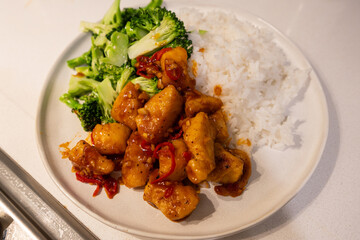 Chilli fish with broccoli and rice.