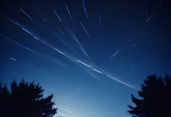 Streaks of light shooting across a dark night sky