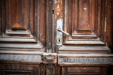 Antique oak entrance door with decorations and carving