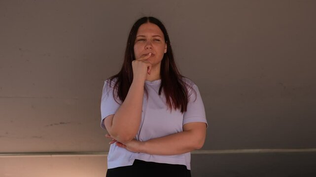 Young fat woman thinking about something