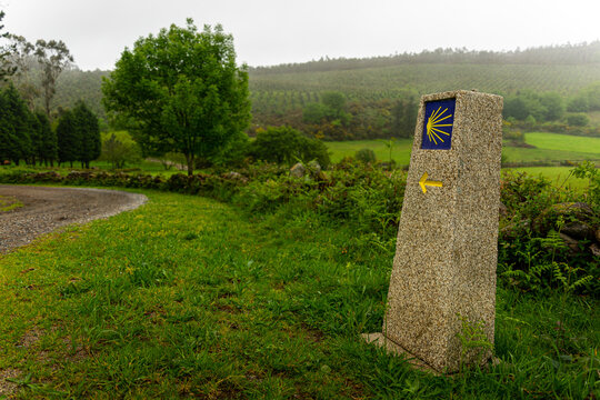Pilgrim Trail Marker in Lush Landscape el camino - Powered by Adobe
