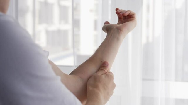 A man strokes his outstretched hand.
Male hand on a white background.
A man massages his hand.
Pain in his hand, a man strokes his hand to relieve the pain.
Male forearm