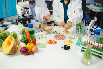 Microbiologist Working on Molecule Samples in Modern Food Science Laboratory, Control experts...