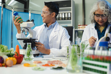 Microbiologist Working on Molecule Samples in Modern Food Science Laboratory, Control experts inspect the concentration of chemical residues. hazards, standard, contaminate.