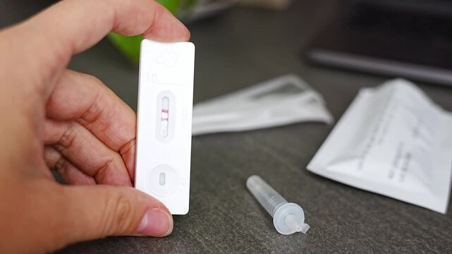 Rapid Antigen Test kit with with Positive result during swab COVID-19 testing. Coronavirus Self nasal or Home test, Autumn exacerbation of viruses