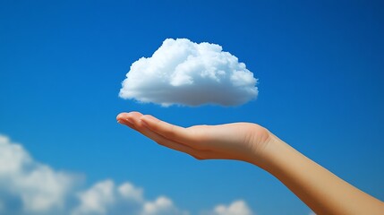 Hand Reaching for a Cloud A human hand reaching up toward a fluffy cloud, symbolizing the act of accessing cloud storage and the user-friendly nature of cloud technology.
