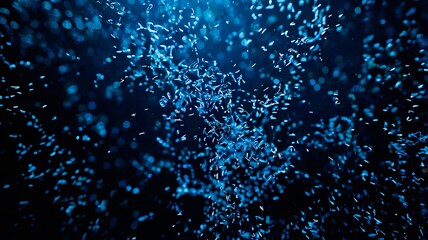 Fototapeta premium Niebieskie Błyszczące Cząstki na Ciemnym Tle