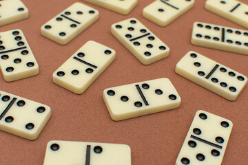 Dominoes bones on brown background	