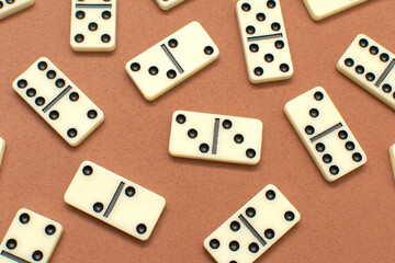 Dominoes bones on brown background	