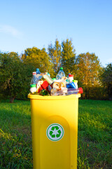 Bottles in Waste container. Waste sorting for Recycling. Glass bottle in trash bin container....
