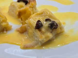 Bread pudding with custard sauce.