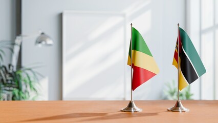 FLAGS OF CONGO R AND MOZAMBIQUE ON TABLE