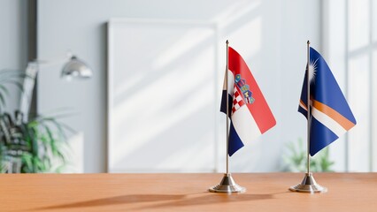 FLAGS OF CROATIA AND MARSHALL ISLANDS ON TABLE