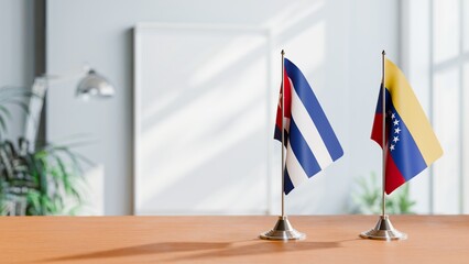 FLAGS OF CUBA AND VENEZUELA ON TABLE