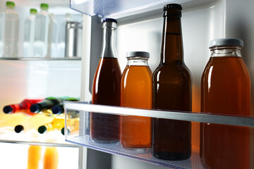 Many different cold drinks in refrigerator, closeup