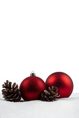 Elegant red baubles with pinecones resting in a snowy landscape, clean and classic holiday decor