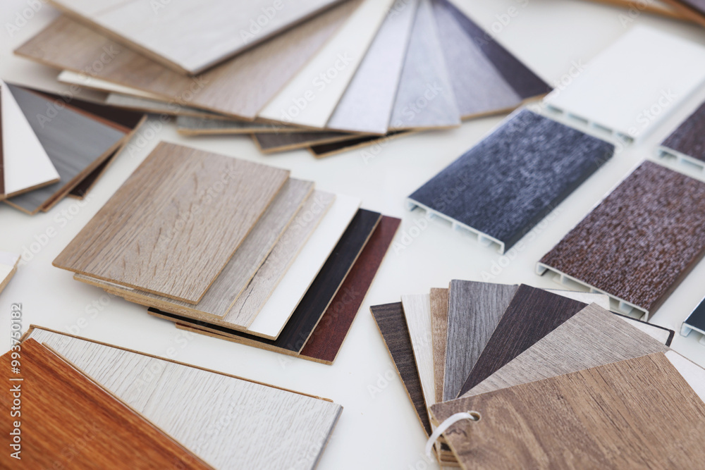 Poster Different samples of wooden flooring on white table