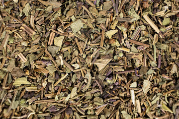 Dry basil spice seasoning macro texture top view