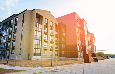 New Modern complex of apartment building on Construction site. Building Construction. Construction of Condo residential building. Colorful Facade of modern apartment buildings. Condominium complex.
