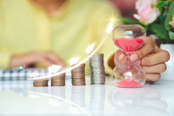 businessman saving money concept stacking coins on table, to manage investments, finance, accounting, budgeting and income planning, business wIith the aim of wealth growth, and business goals.
