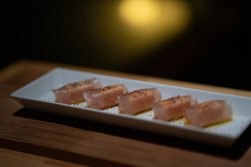 Ham and cheese neatly arranged on a plate