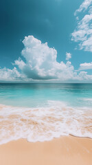 Fototapeta premium A serene beach scene with soft golden sand, gentle waves lapping the shore, and a calm turquoise ocean under a bright blue sky