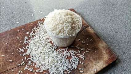Selective focus of a collection of rice on cutting board. concept of zakat and alms
