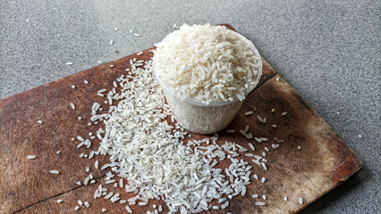 Selective focus of a collection of rice on cutting board. concept of zakat and alms