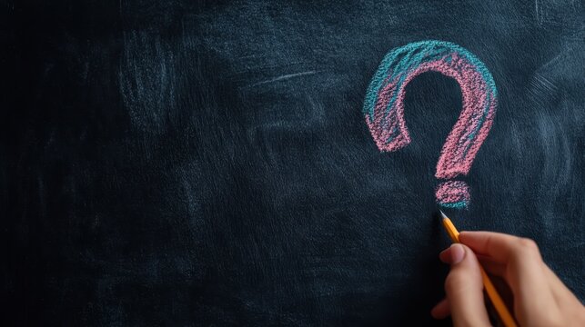 A hand draws a colorful question mark with blue and pink hues on a dark chalkboard, symbolizing curiosity, inquiry, and the creative educational process. - Powered by Adobe