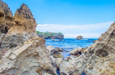 Fototapeta premium Wild shore with rocks and stones along the coast of northern Spain, Muxia, Galicia, September 12, 2024