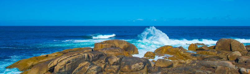 Obraz premium Wild shore with rocks and stones along the coast of northern Spain, Muxia, Galicia, September 12, 2024