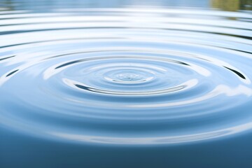 A close-up view of concentric ripples on a surface, likely water
