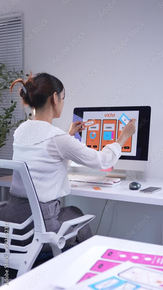 Sticker asian woman designing user experience for a mobile application, focusing on interface elements and u