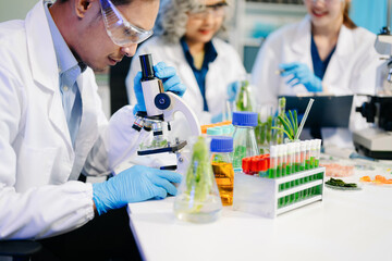 Fototapeta premium Food scientists in lab coats, testing samples, and analyzing food safety and quality in a modern laboratory