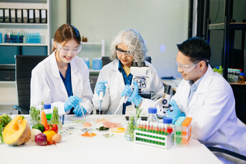 Food scientists in lab coats, testing samples, and analyzing food safety and quality in a modern laboratory