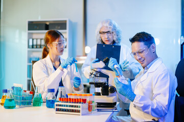 Fototapeta premium Scientist team meeting and writing analysis results in the laboratory study