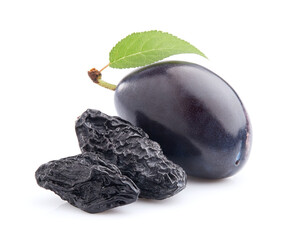 Prunes and plum with leaves in closeup