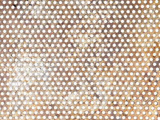 rusty perforated steel sheet textured, row of round holes on metallic plate