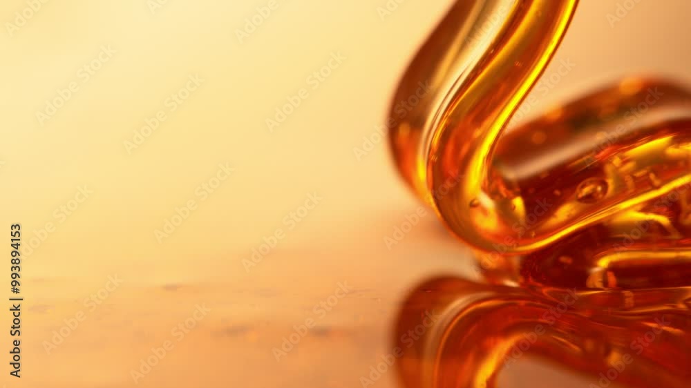 Poster Super Slow Motion of Dripping Honey Creating Wavy Shape in Detail. Extreme Macro Shot, Selective Focus. Filmed on High Speed Cinema Camera, 1000 fps.