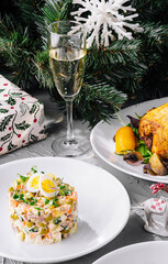 Festive holiday dinner with champagne and roasted chicken