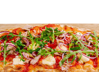 Fresh gourmet pizza with arugula on wooden board