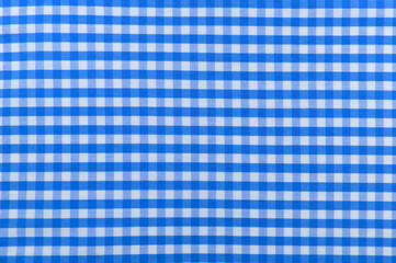 Checkered blue fabric. Textile. Checkered fabric background with blue and white cells