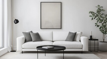 White sofa and black coffee table against white wall with art poster Scandinavian boho home interior design of modern living room