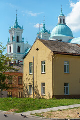 Obraz premium The Catholic church. The old red brick church. A historical building with a religious purpose.