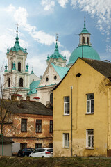 Fototapeta premium The Catholic church. The old red brick church. A historical building with a religious purpose.
