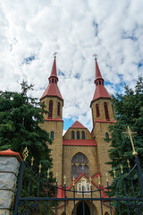 The Catholic church. The old red brick church. A historical building with a religious purpose.