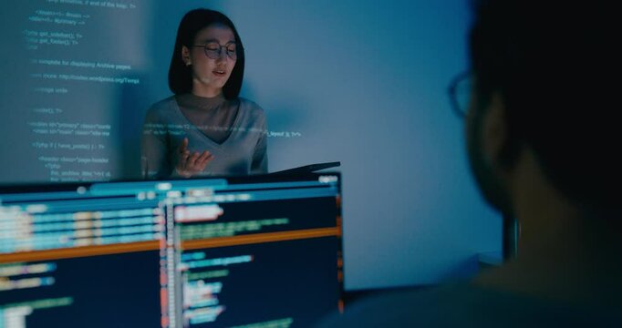 Group adult Asia female software developer mentor leader manager talk strategy plan to executive write prompt AI bot IT app program nomad, video game, designer, data center. Projecting slideshow code. - Powered by Adobe
