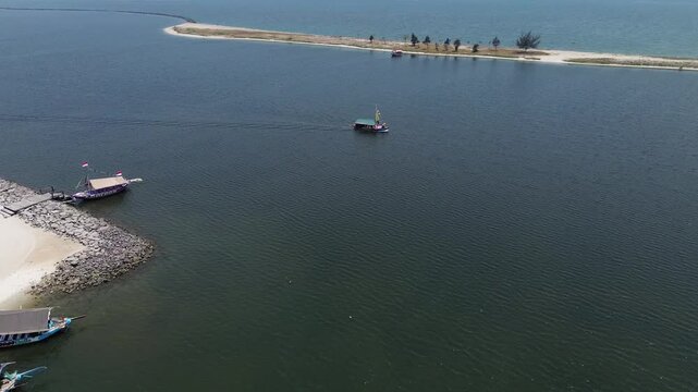 Tourist boats and speedboats at Ancol beach Jakarta, traveling, vacation, theme park