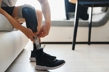 Close-up elevated view of a man adjusting the screws on an artificial prosthetic leg