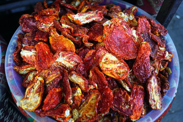 Ingredients for local cuisine for sale at a bazaar in the center of Gaziantep: a close-up photo of chopped and dried red paprika. Dehydrated products at an authentic Turkish market.